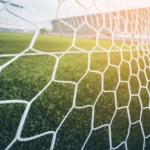 A picture of a net on a football field.