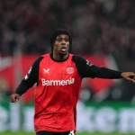 Jeremie Frimpong of Bayer 04 Leverkusen gestures during a Champions League Round of 16 game