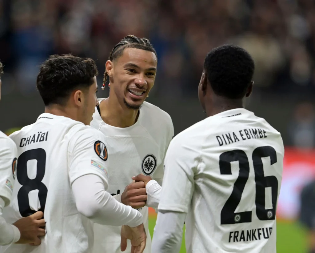 Hugo Etikete celebrating with his Eintracht Frankfurt teammates.