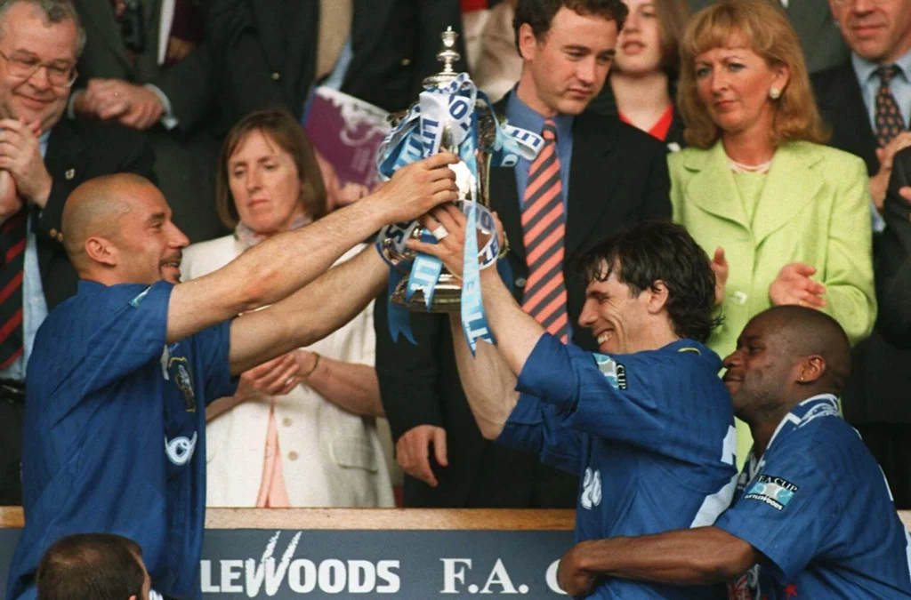 Chelsea's Gianluca Vialli (left) and Gianfranco Zola hold the FA Cup aloft