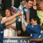 Chelsea's Gianluca Vialli (left) and Gianfranco Zola hold the FA Cup aloft